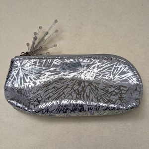 MAC shiney make-up case. Oval shape. No stains